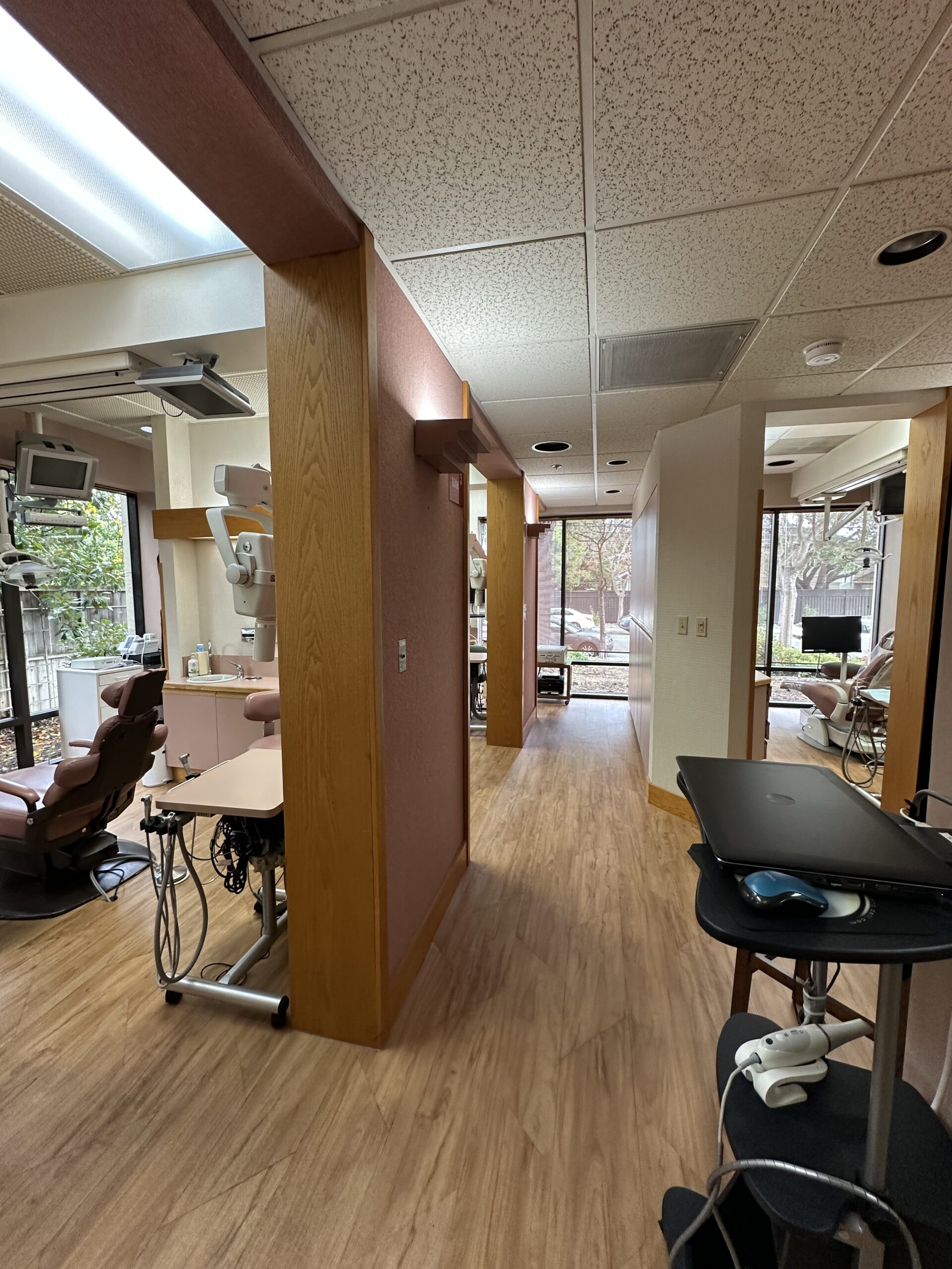 Modern dental office reception area with comfortable seating